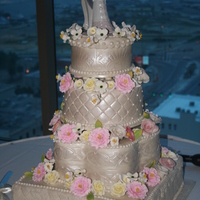 Multi Shaped Tier Embossed Formal Wedding Cake This is my first Wedding Cake with gum paste flowers and mmf. I made lemon curd and fresh raspberry sauce filling, alternating each tier....