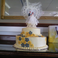 Wedding Cak Bridal white wedding cake w/almond flavoring, chocolate ganache filling and buttercream frosting with fondant flowers