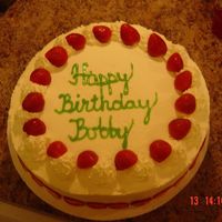Bobby's Birthday Cake Yellow genoise cake with strawberry flavored whipped cream icing with with fresh strawberries