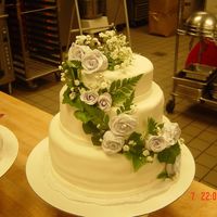 Wedding Cake three tiered wedding cake with fondant roses with ivy and baby's breath accents
