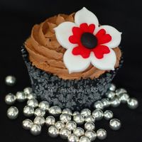 Black And White Birthday Cupcakes White Choc mud cake with whipped choc ganache frosting.