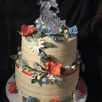 Buttercream Wedding Cake Buttercream wedding cake with gumpaste flowers. Topper provided by the bride