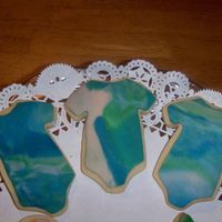 Hpim4116.jpg Just fooling around with some left over fondant and my new onesie cutter. NFSC and MMF