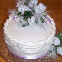 Practice Cake Wanted to practice fondant (yet again) and love to incorporate feathers into my cakes.Enhanced yellow cake w/raspberry filling