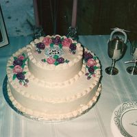 Anniversary Cake My parents 25th Anniversary cake. All buttercream.A little "munchkin" stuck his finger in the cake!