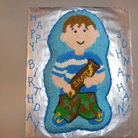 Dscf1987.jpg A little foster child at church saw me finishing a cake and promptl put in his "order" for a camoflauged skateboard cake. I made...