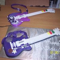 Hannah Montana Guitar Cake Fondant covered cake with fondant details.
