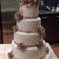 Cappuccino Gold Rose Wedding Cake This was my firs real wedding cake I made and it was for my best friend's wedding! There are two fake tears in the cake the top tier...