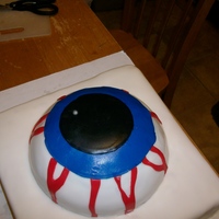 Halloween Eye Did this one for a girl @ work, all work is done in fondantIts a yellow butter cake, with bavarian cream filling