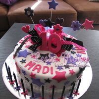 Star Birthday Cake Vanilla cake iced with fondant, covered in stars and fondant accents with lots of shimmer and ribbons. A special cake for a 10 year old -...