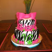 Sweet 16 Cake This is a WASC 2 tier cake with buttercream icing and mmf zebra stripes, dot border, bow and tag, and numbers and letters. It was really...