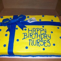 Blue And Yellow Cake This is a 12x18 yellow cake with buttercream icing. The bow and tag are mmf. Enjoy!