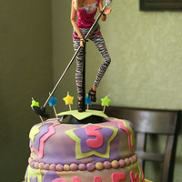 Rock Star Birthday Cake This is my first tie-dyed cake and my first 2 tiered fondant cake. There were alot of bumps along the way and I had to do a lot try to...