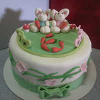 Twin Bunny Cake A twin is turning 6,since their birthday is easter day..i decided to make twin bunny as topper..thanks for viewing.