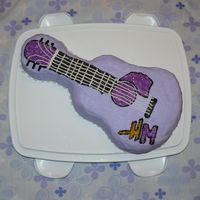 Hannah_Cake.jpg Hannah Montana Acoustic Guitar Birthday Cake for my daughter's 7th birthday.Buttercream Icing and Supar SprinklesUsed Wilton Guitar...