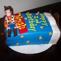 Cowboy Cake The 2 year old boy loves Woody and anything that has to do with cowboys.The cake is 1 layer chocolate, 1 layer vanilla and the bottom is...