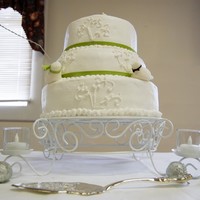 3 Tier Wedding Cake My daughter wanted a simple white cake with buttercream frosting and love birds on it. The love birds are fondant. Top layer is pistachio,...