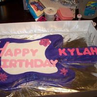 Purple Guitar 4 year old girl loves Hannah Montana so I make a purple guitar cake.The cake is strawberry with buttercream frosting and fondant lettering...