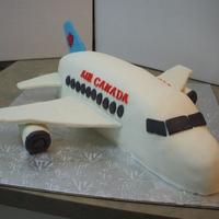 Airplane An Air Canada plane for a co-workers son who wants to be a pilot. Fondant covered chocolate fudge and vanilla 3 layer cake. Wings are...