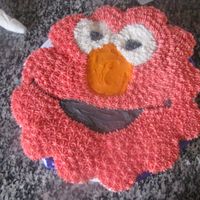 Elmo Cupcake Cake This is cupcakes. I used the shaped Elmo pan to draw the shape onto the cake board. Then just put the cupcakes on the shape. Frosted with...
