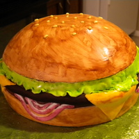 Cheeseburger Cake: 1 - 8 inch round and 1 - soccer ball pan filled and covered in fondant.All decorations made from fondant, and hand-painted.