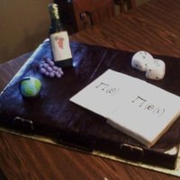 Personalized Birthday Cake Chocolate suitcase cake covered in chocolate fondant, and gold details. Wine bottle made from rice krispie treats covered in fondant,...