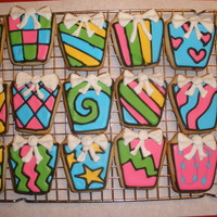 50Th Birthday Present Cookies Sugar Cookies with RI, made for a surprise birthday party for my aunt's 50th birthday. I kinda gave up by the time I got to the bows;...