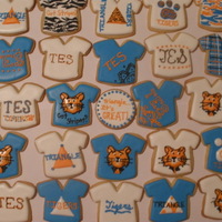Triangle School T-Shirt Cookies Cookies I made for my mom to take to work for her coworkers (the school?s mascot is Stripes the Tiger). Sugar cookies with royal icing. I...