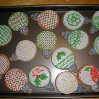 Christmas Ornament Cookies Sugar Cookies with RI. Silver & gold accents painted with luster dust. Made as gifts for friends at school.