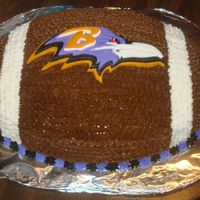 Raven's Football Cake I made this cake for my father's birthday. It is a chocolate cake, iced with buttercream icing, and the Raven is made from Fondant....