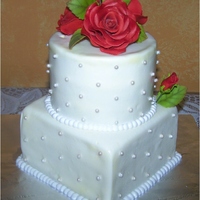 Small Wedding Cake This was a cake I made for a sample of my work for a meeting. It was yellow cake with lemonade filling.