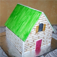 Little House Cake This was done as a sample cake for a meeting. Cocolate cake with carmel filling. Not much detail but they liked it.