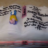 Book Birthday Cake I made this cake for my neice for her 13th birthday. The figure is made out of candy clay.