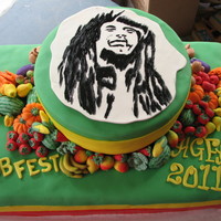Bob Fest 2011 50/50 (gumpaste/ fondant) fruits & veggies. Bob Marley is paste icing color painted onto 50/50. inside is vanilla cake colored red gold...