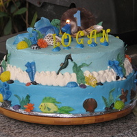 Logan's 1 Yr Cake Buttercream with 50/50 fish, shells, coral, etc. gumpaste letters