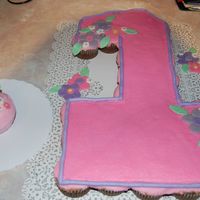 Dsc_0029.jpg This was our 1st cupcake cake. We made a matching smash cake. The cupcakes were chocolate covered in buttercream w/fondant flowers. The...