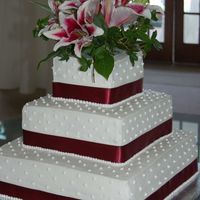 My Favorite Wedding Cake This was our very 1st wedding cake and our absolute favorite. It's buttercream. The ribbon matched the bridesmaids' dresses.