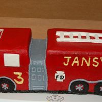 Firetruck_2.jpg Buttercream with fondant accents: ladder, windows, FD symbol