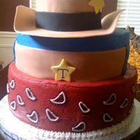 Cowboy Baby! Hat brim made of fondant, propped up and left out to dry a few days before to ensure curled edges. Buttercream with fondant accents. Thanks...