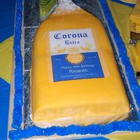 Corona Beer Bottle Cake Vanilla cake with pineapple filling, covered in fondant.