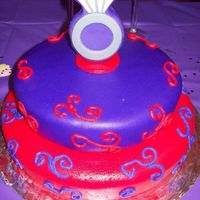 Bridal Shower/wedding Ring Cake top tier 8" & bottom tier 10". cake was made out of red velvet (box). This was my first cake with MMF. Loved it!! Cake is MMF...