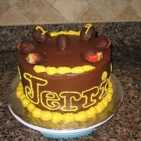 Jerri's 19Th Bday Cake chocholate cake, covered in chocolate icing with yellow b/c accents & topped with chocolate covered strawberries