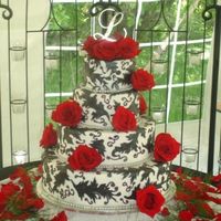 Lewis Wedding one of my favorite cakes ever to date...6-8-12-16" cakes, covered in fondant and accents done iwth black fondant and RI piping.