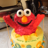 Elmo Surprise elmo is RKT covered with buttercream, these were the second set of arms, had a hard time with them, think maybe i needed to let it dry out...