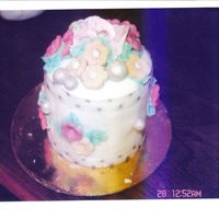 Mini Indivisual Wedding Shower Cake Lamon cake soked in limoncello liqour, frosted with buttercream and covered in fondant. decorations are fondant and royal icing .