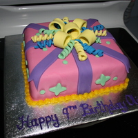 Pretty Present Chocolate cake covered and decorated with fondant..