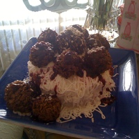 Spaghetti And Meatballs! Yummy! Cake with buttercream frosting. Cocoa rice krispies for meatballs and raspberry preserves for sauce.