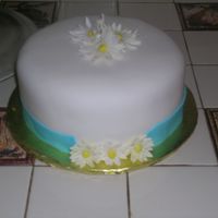 Practice Cake Practice cake for 3rd Wilton Class. Didn't roll enough for the border so filled it in with some GP daisies. TFL