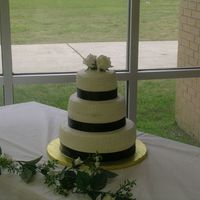 My First Wedding Cake This is my first real cake. I was extremely nervous about it. I had trouble with the crumb coat, but thanks to Indydebi's help I was...