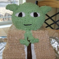 Yoda this was a birthday cake for my husband he loves yoda I modeled it after his lego yoda who is almost as tall as this cake. His head and...